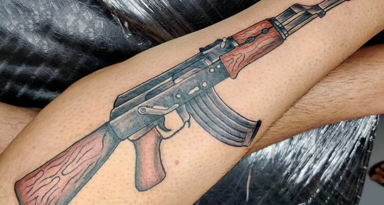 ak 47 tattoo/angel holding ak 47 tattoo/ak 47 tattoos